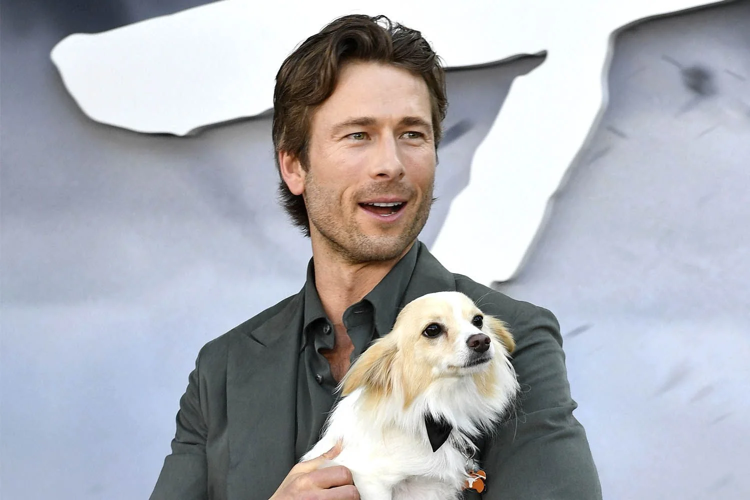 Glen Powell Jokes His Dog Brisket Was 'Living His Best Life' with the Crew on “Running Man ”Set (Exclusive)